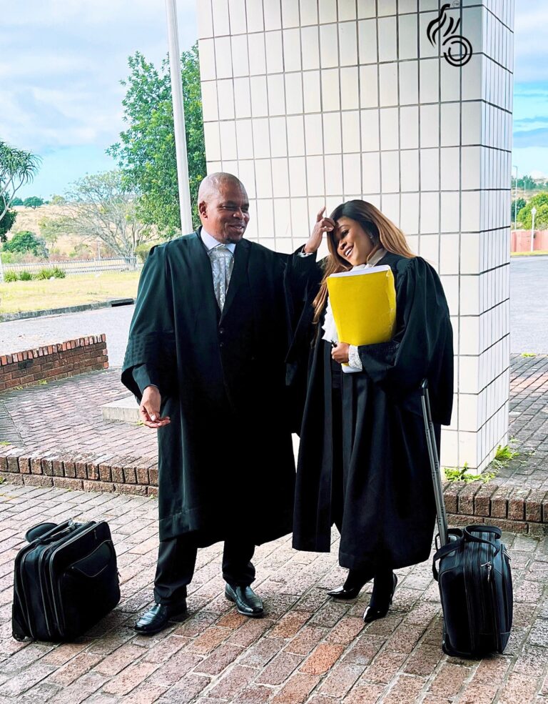 female and male advocates outside court 768x985